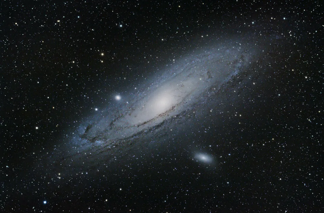 The Andromeda Galaxy (M31) imaged with a stock Canon 450D DSLR, showing a purple-shifted color cast, courtesy of Trevor Jones at AstroBackyard