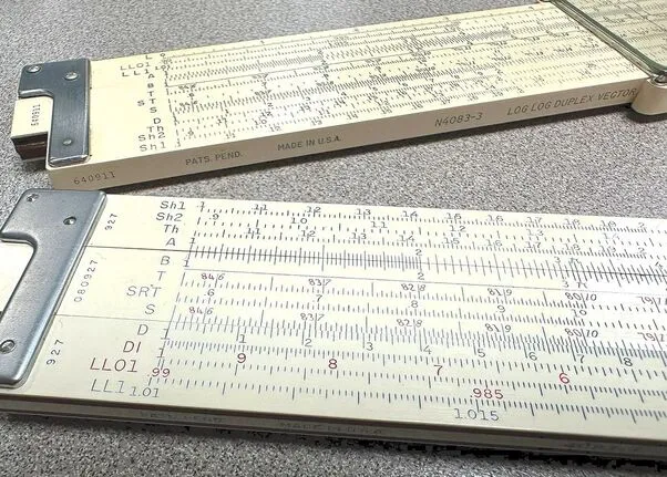Two K&E Log Log Duplex Vector slide rules, a 10-inch and a 20-inch, shown together