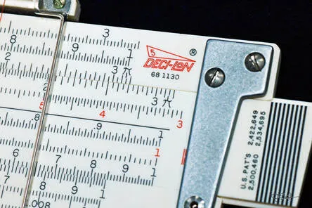 A close-up art shot of the Deci-Lon 5 pocket slide rule