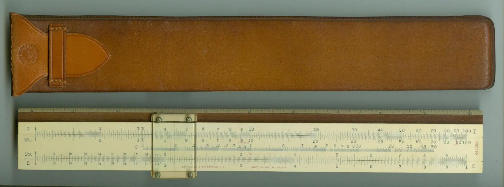 The K&E Model 4165 Urea Index Rule, a 10" Mannheim-style rule with celluloid facings on mahogany, front side and case