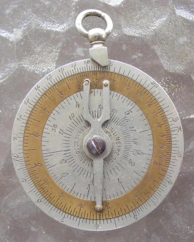 Charpentier Calculator front side, showing the D scale outer ring, articulating copper C scale ring, and inner square-root scales