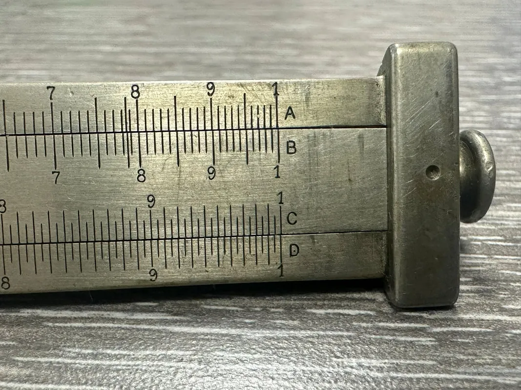 Side 1 of the Model 4095 Triangular Metal Rule, showing the A, B, C, D scale labels