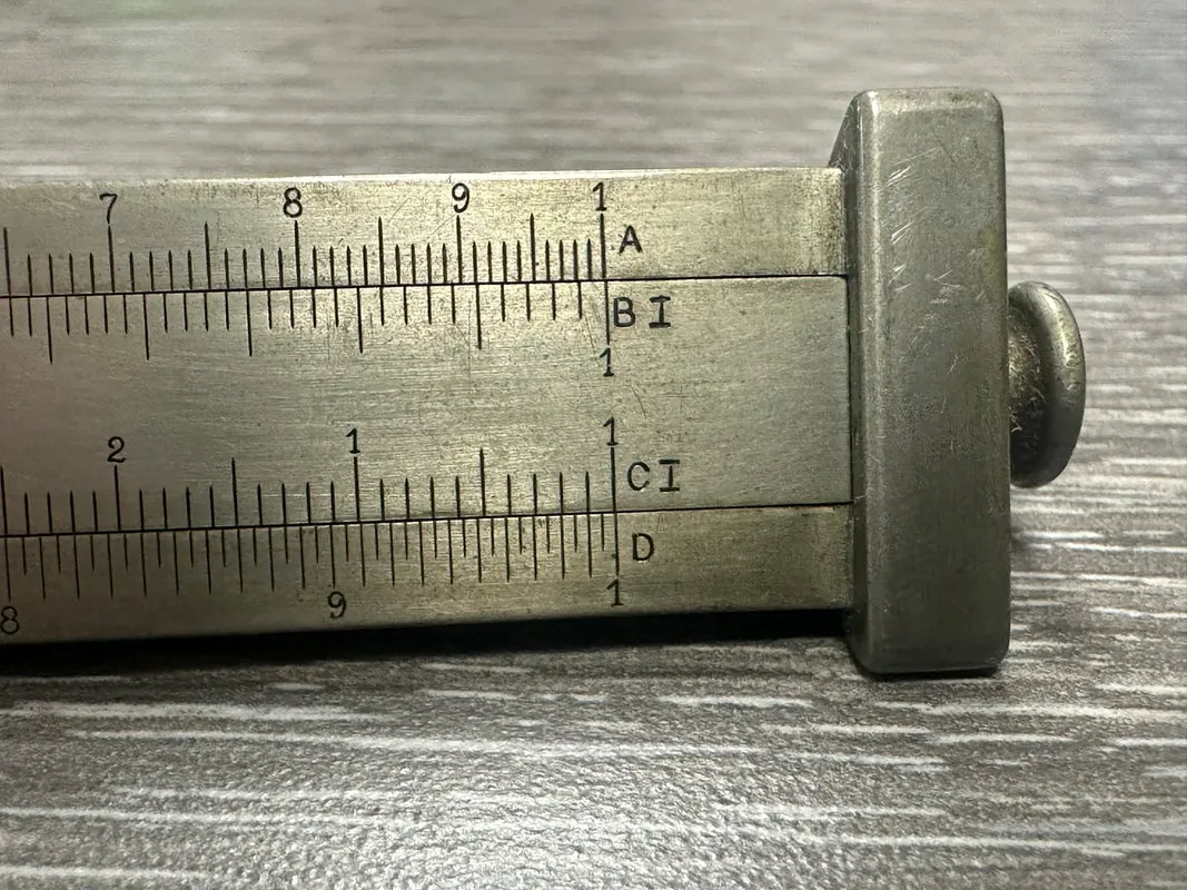 Side 2 of the Model 4095 Triangular Metal Rule, showing the A, BI, CI, D scale labels