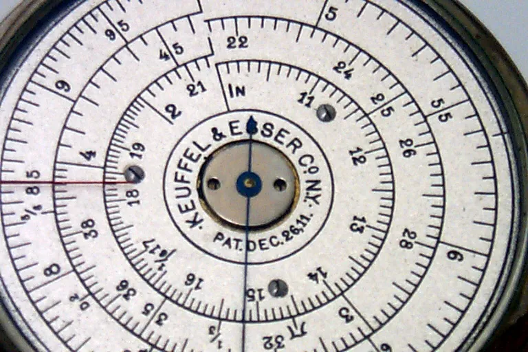 Close-up of the K&E Pocket Watch Calculator (Model 4018) dial, stamped 'Keuffel & Esser Co. N.Y.' with a patent date of December 26, 1911