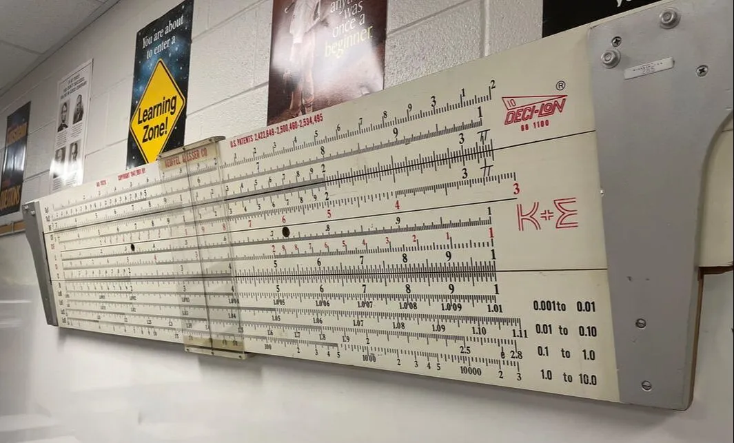The author's Model 68-1929 Deci-Lon Demonstrator, a 6.5-foot redwood rule hanging in his classroom