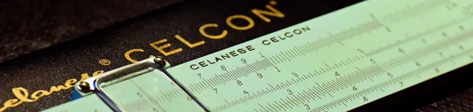 A close-up of a Keuffel & Esser Celanese Celcon slide rule
