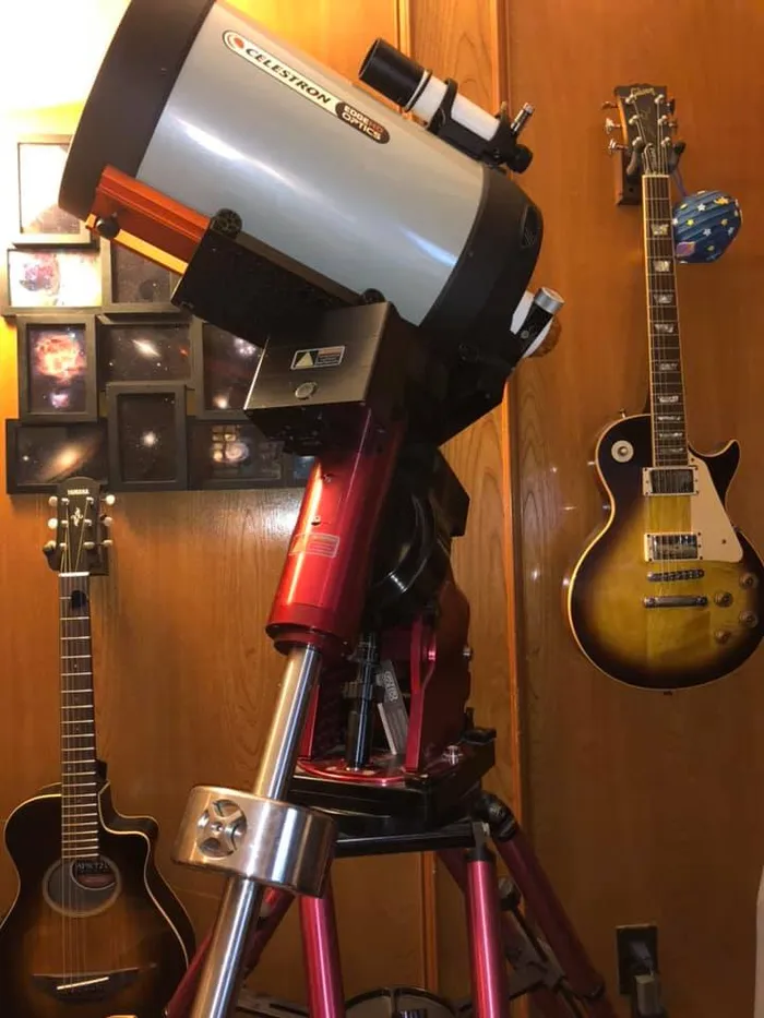 A Celestron C-11 Edge SCT on a Paramount MX+ mount, with a Gibson Les Paul guitar nearby