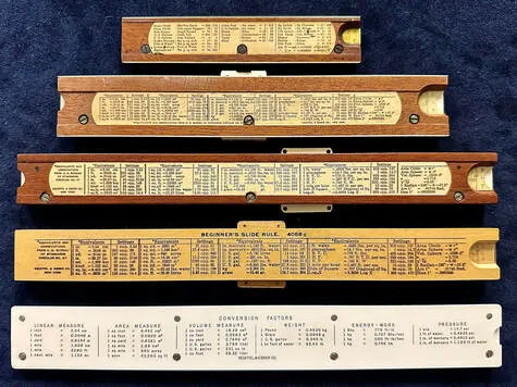 A K&E single-sided rule showing formula and conversion charts on its back