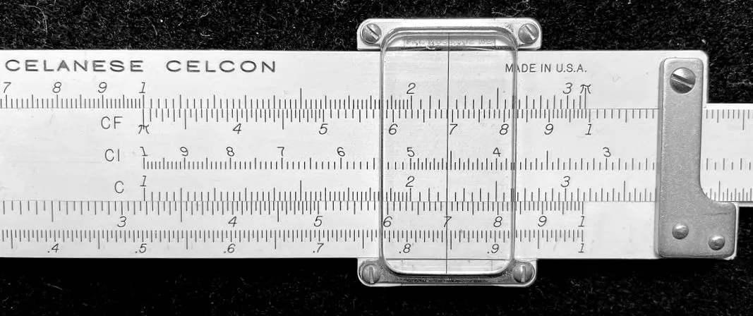 A slide rule's folded CF/DF scales set to pi