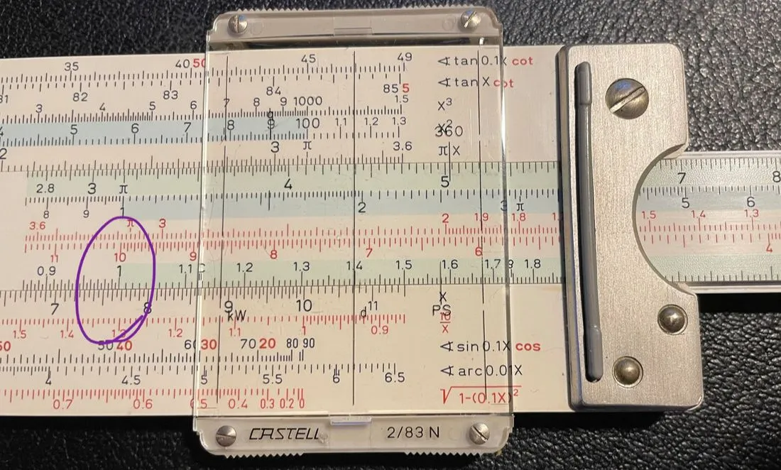A slide rule multiplying 0.766 by 14 to solve for x